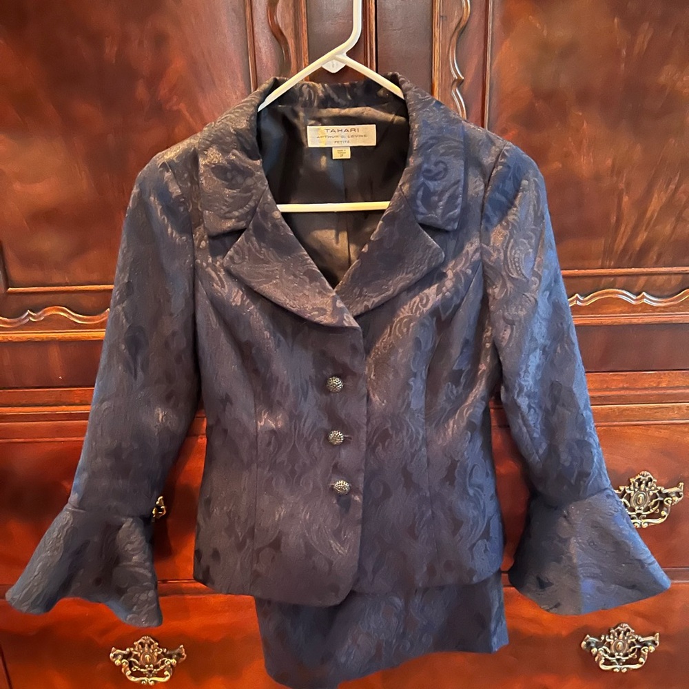 Women’s petite two piece skirt suit.